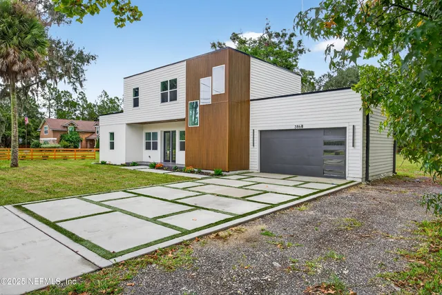 a front view of a house with yard