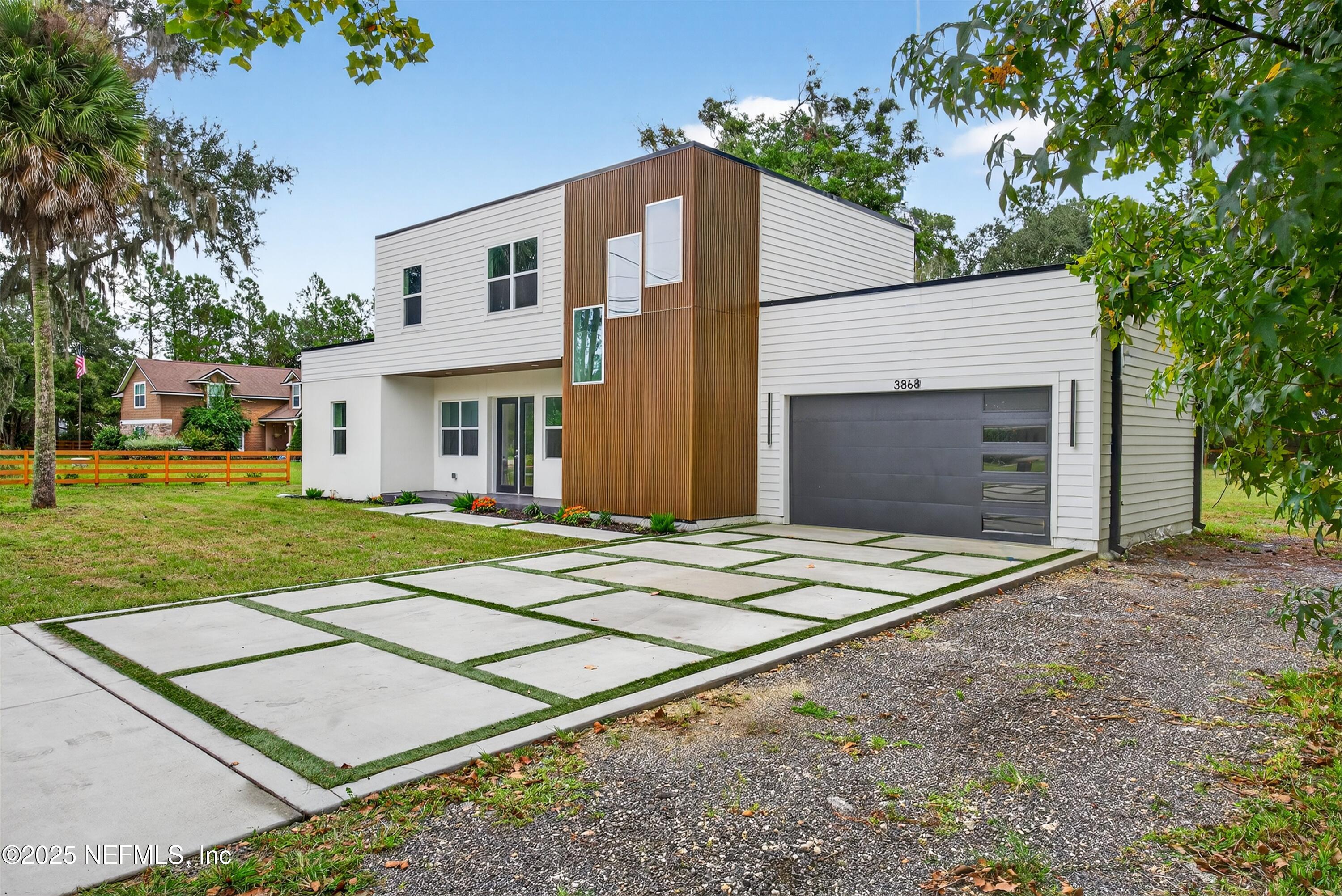 a front view of a house with yard