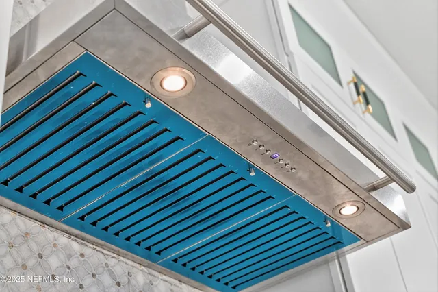 a room with a table and a mirror