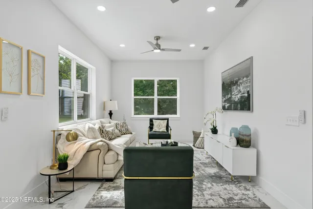 a bathroom with a double vanity sink mirror and bathtub
