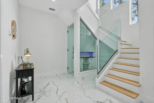 a view of a room with a white walls