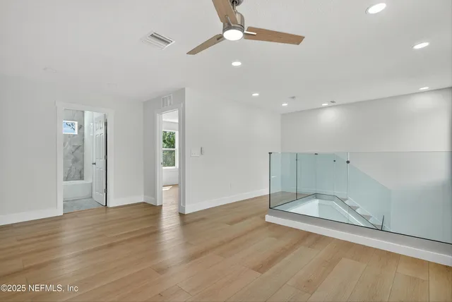 a house that has a tree in front of the house