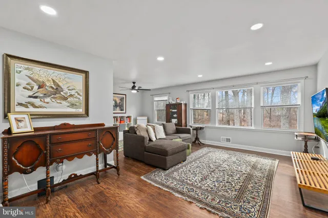 a living room with furniture and a rug