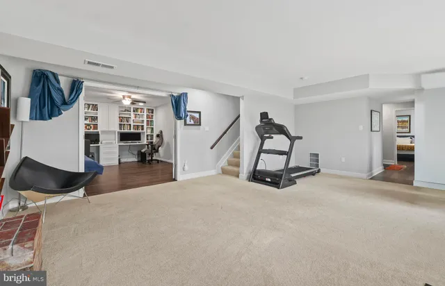 a bedroom with furniture and natural light
