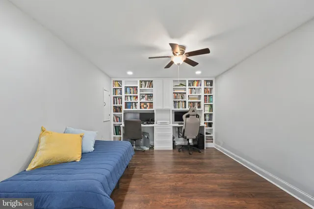 a living room with furniture and view of kitchen
