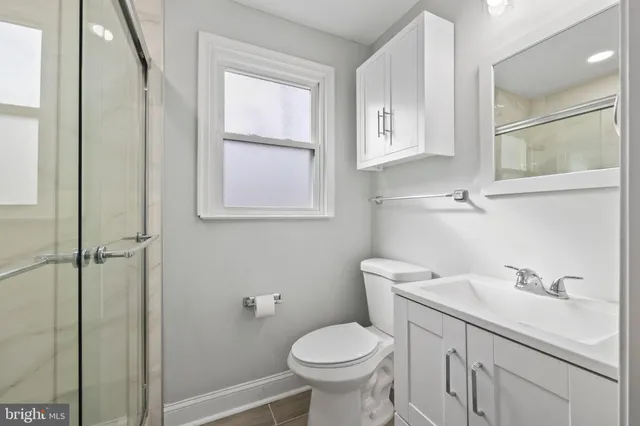 a bathroom with a sink toilet and vanity