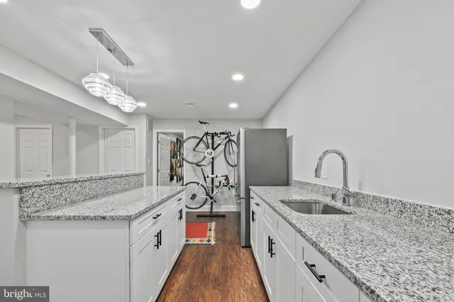 a kitchen with sink cabinets and stove