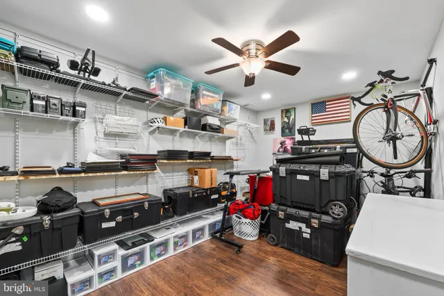 a kitchen with stainless steel appliances granite countertop a stove and a wooden floors