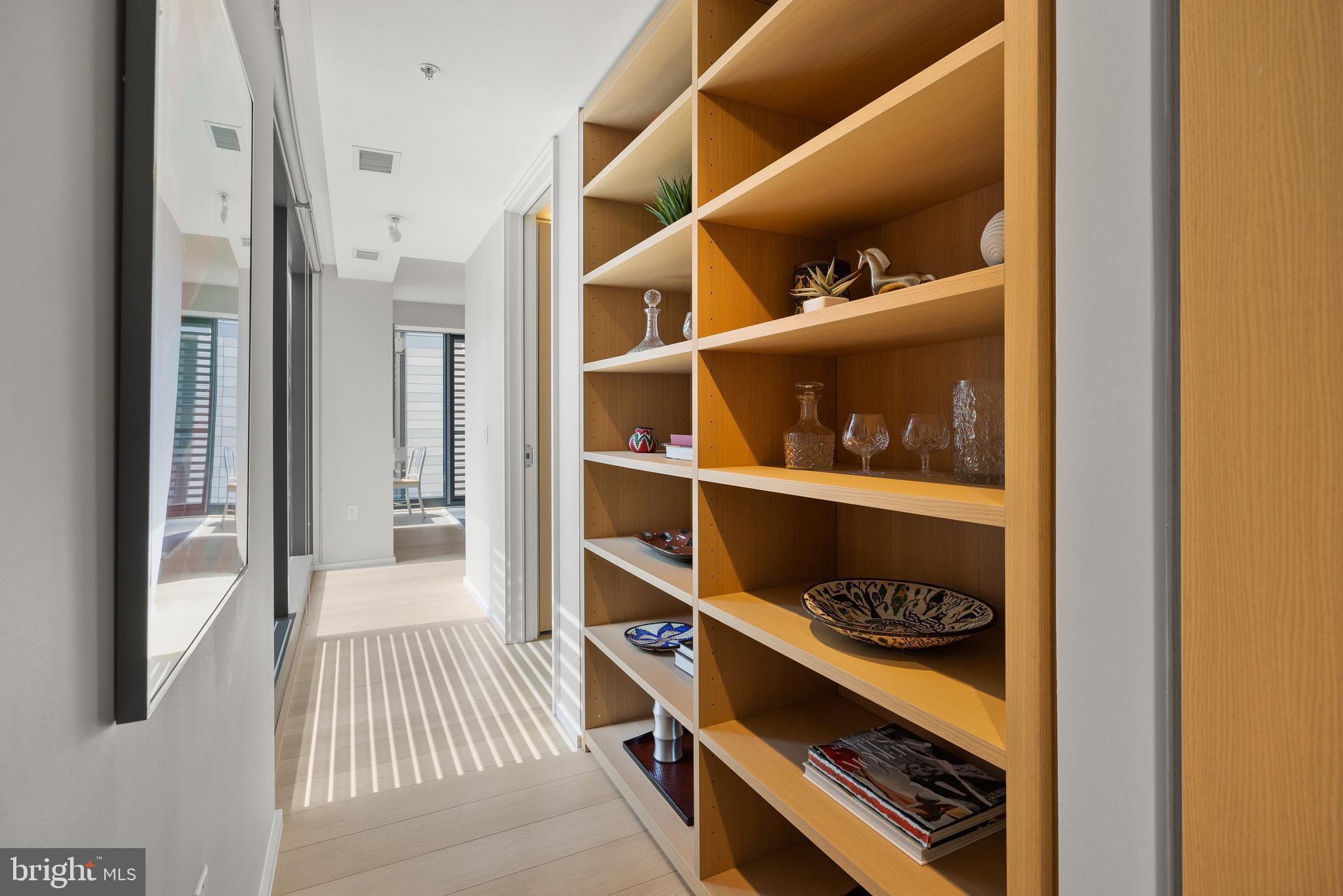 925 H Street Northwest, Unit 501 Washington, DC 20001 - Photo 5 of 32 Wall of Custom Built-Ins