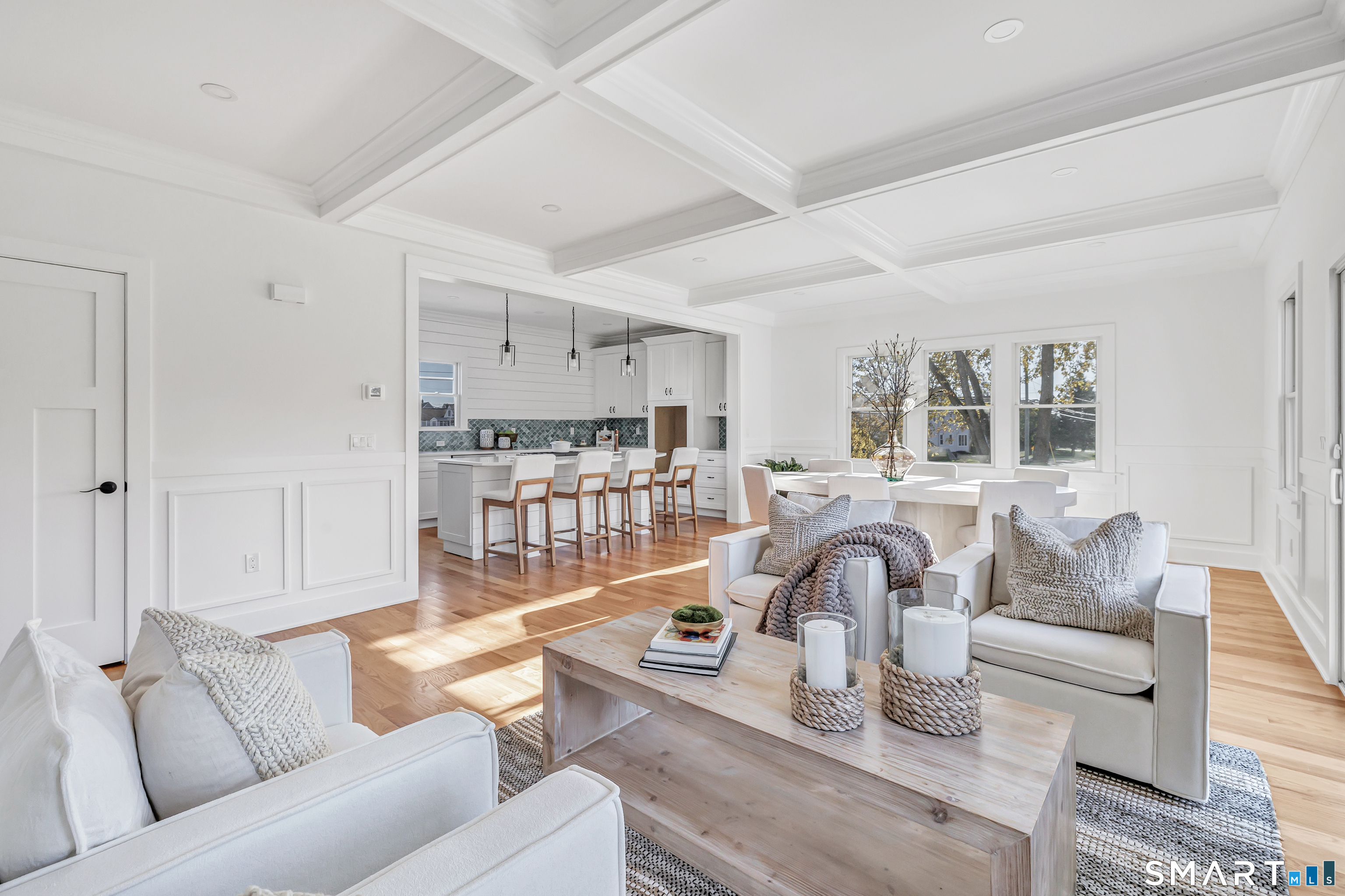 212 Milford Point Road Milford, CT 06460 - Photo 10 of 40 a living room with furniture and a view of kitchen