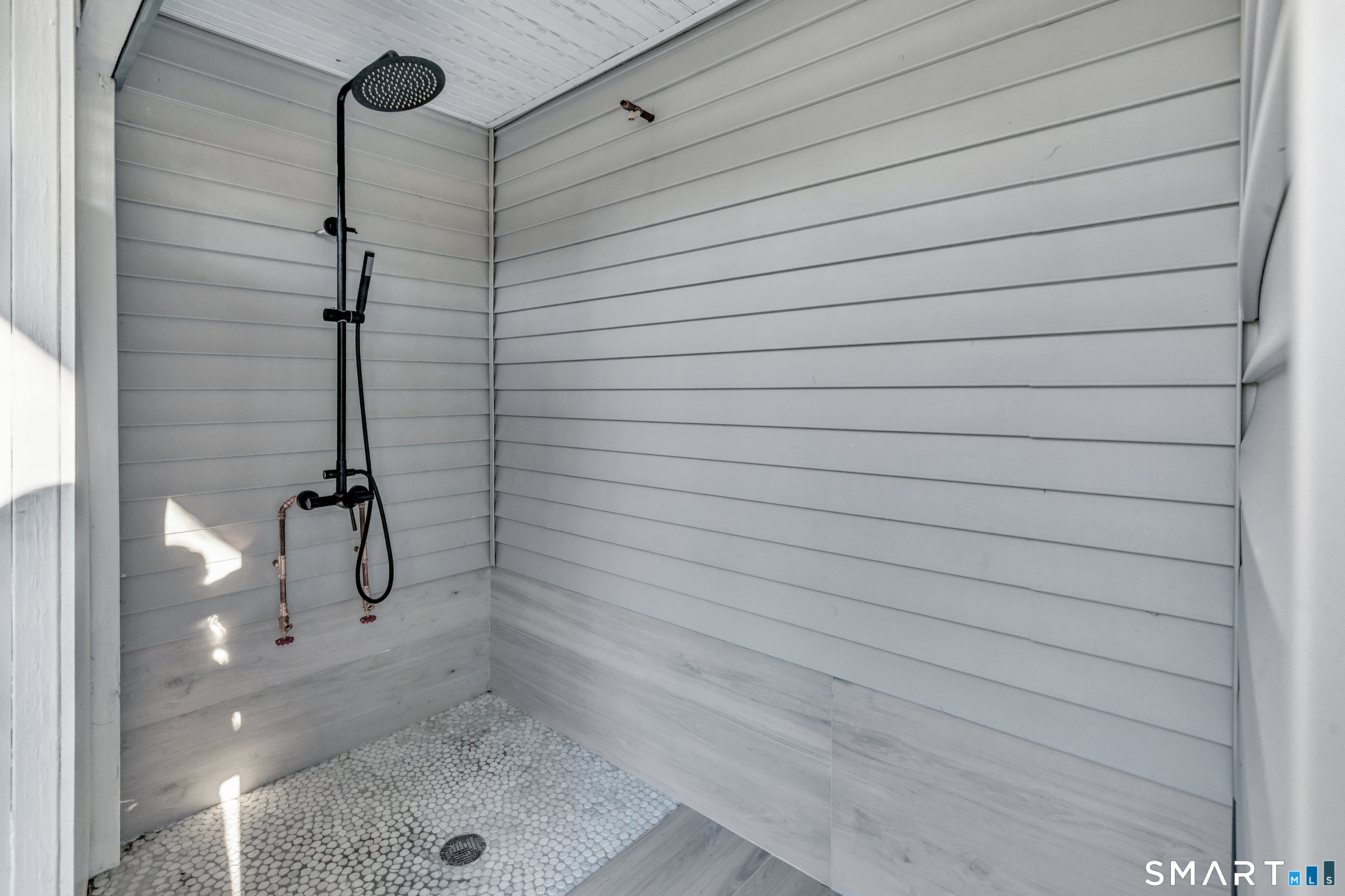 212 Milford Point Road Milford, CT 06460 - Photo 2 of 40 a bathroom with a shower