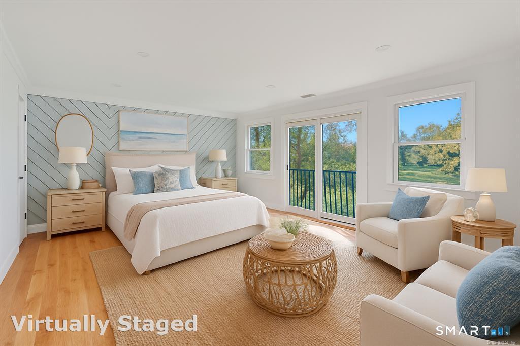 212 Milford Point Road Milford, CT 06460 - Photo 23 of 40 a bedroom with furniture and a large window