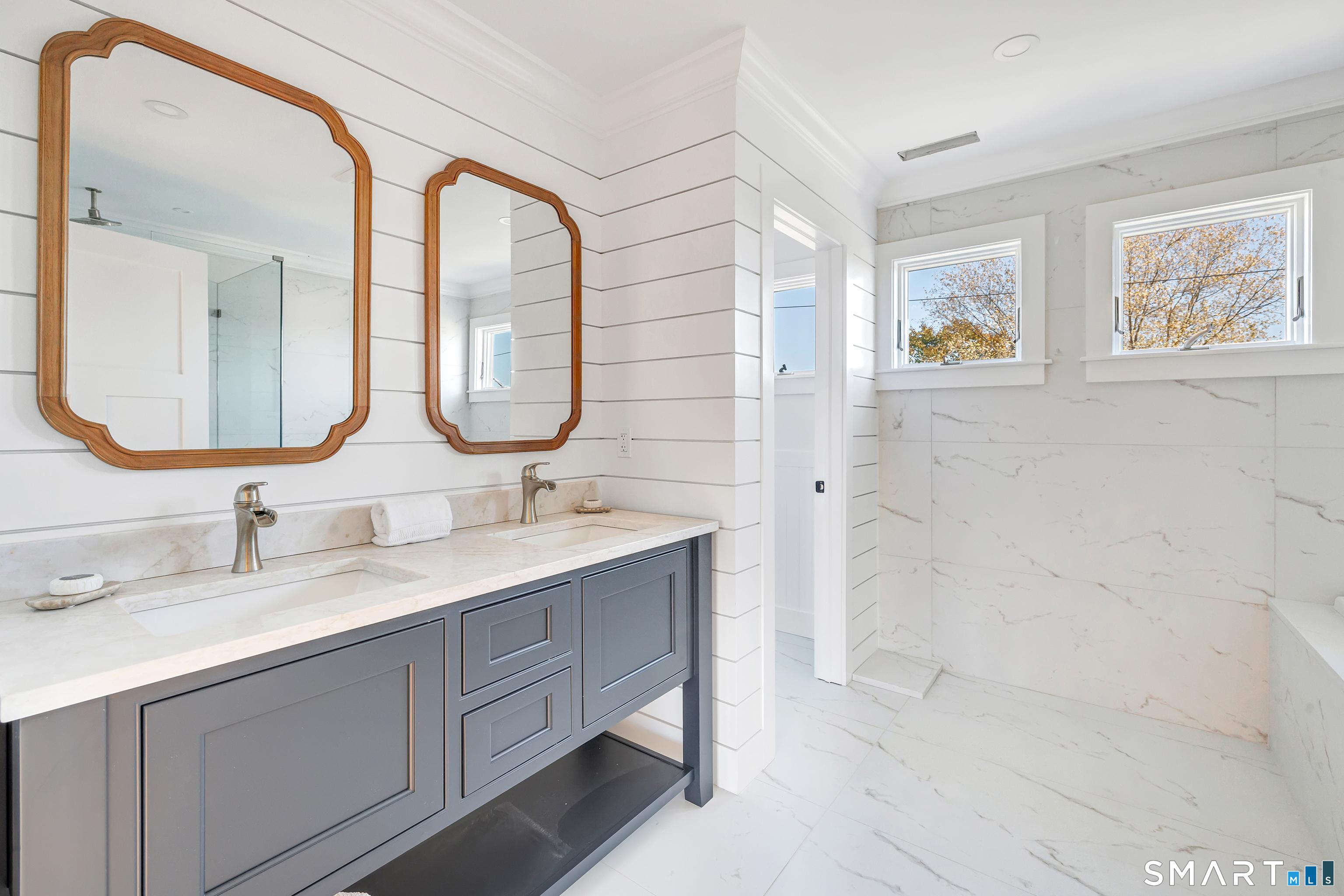 212 Milford Point Road Milford, CT 06460 - Photo 25 of 40 a bathroom with a double vanity sink mirror and a