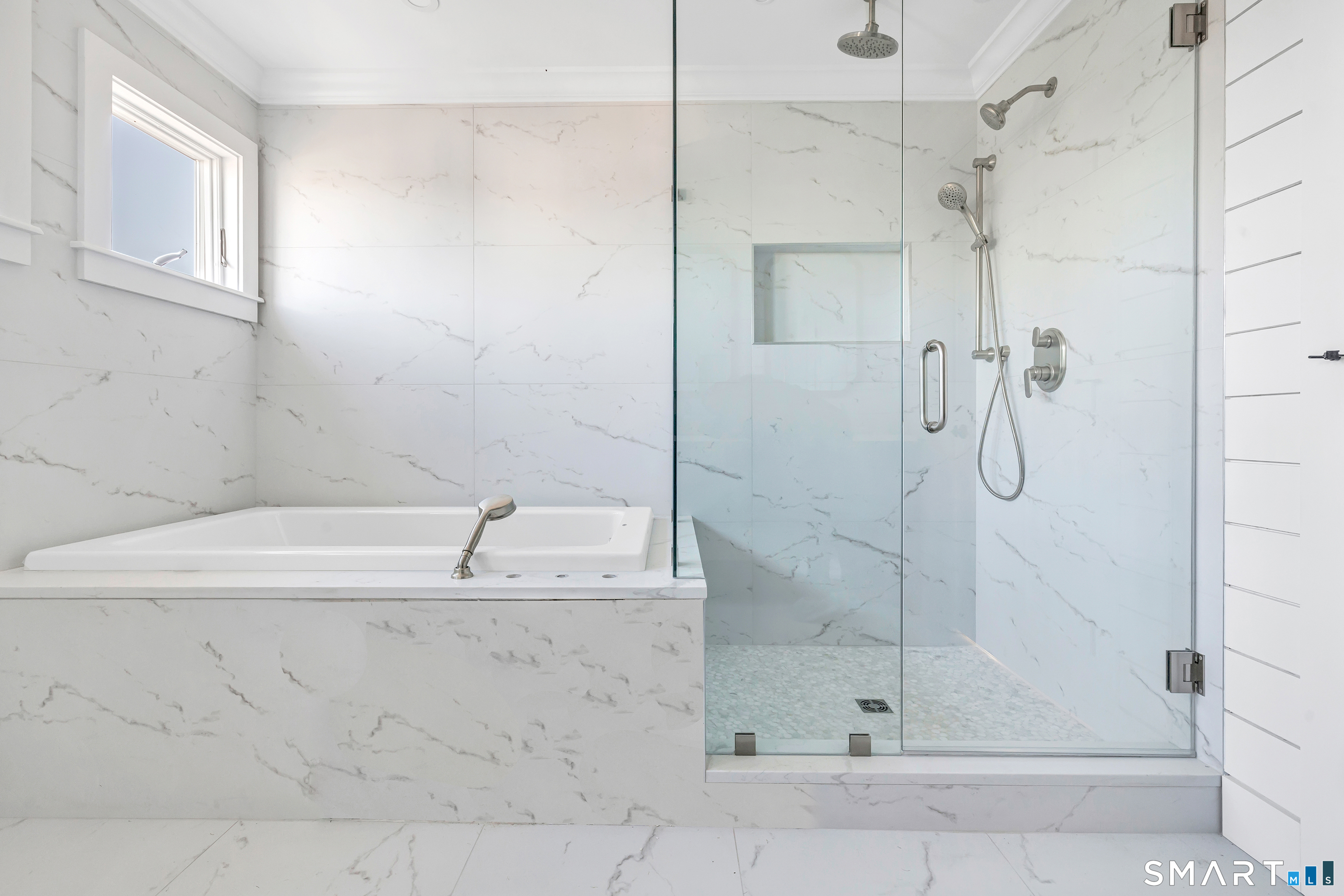 212 Milford Point Road Milford, CT 06460 - Photo 26 of 40 a bathroom with a bathtub and a shower