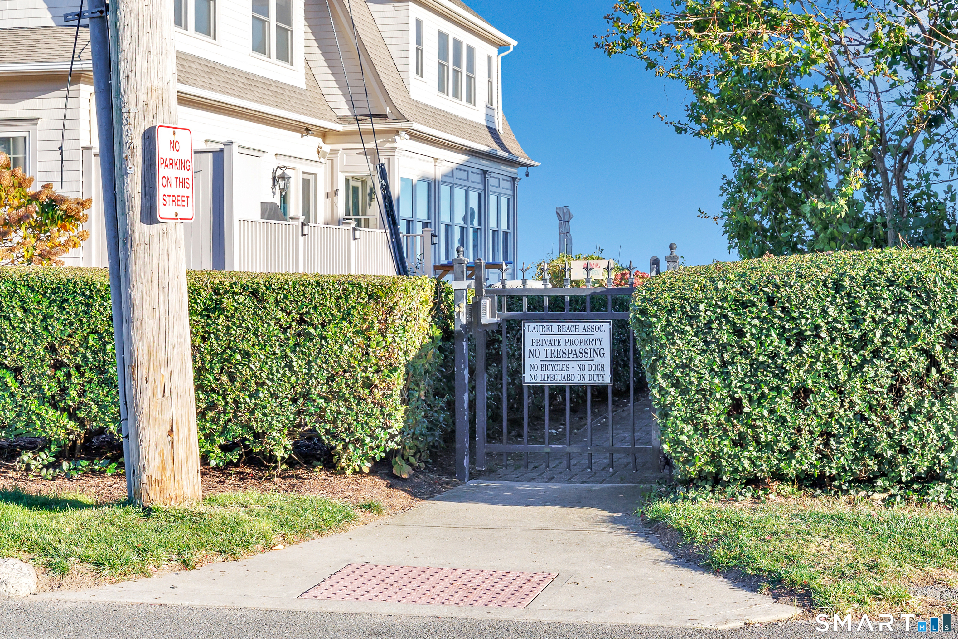 212 Milford Point Road Milford, CT 06460 - Photo 33 of 40 a view of a patio with table and chairs potted plants
