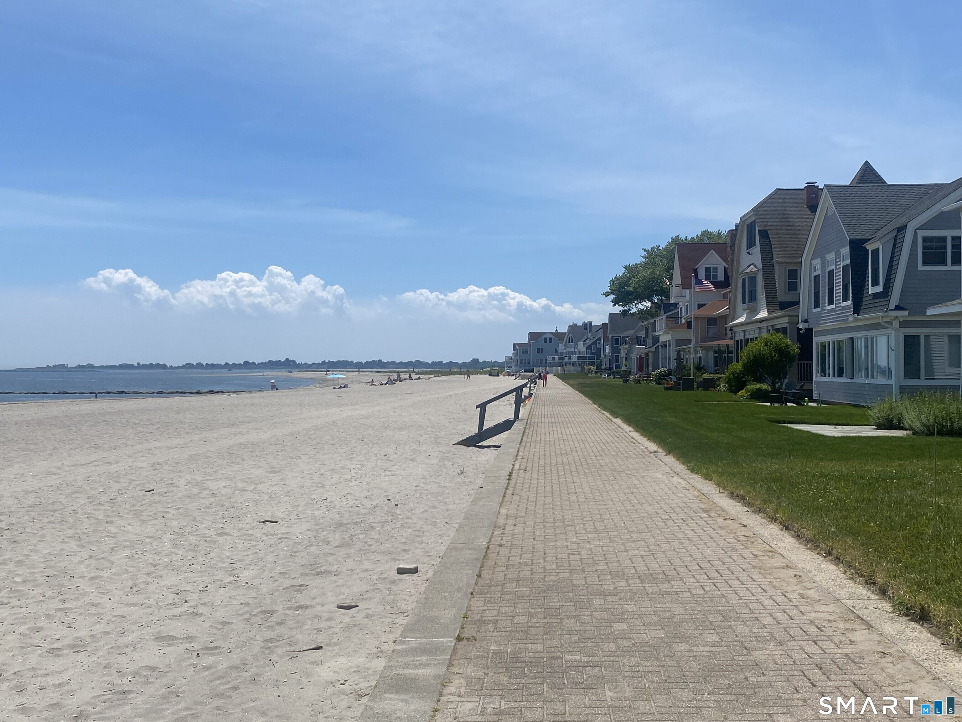 212 Milford Point Road Milford, CT 06460 - Photo 5 of 40 a view of a lake with a garden and a signage