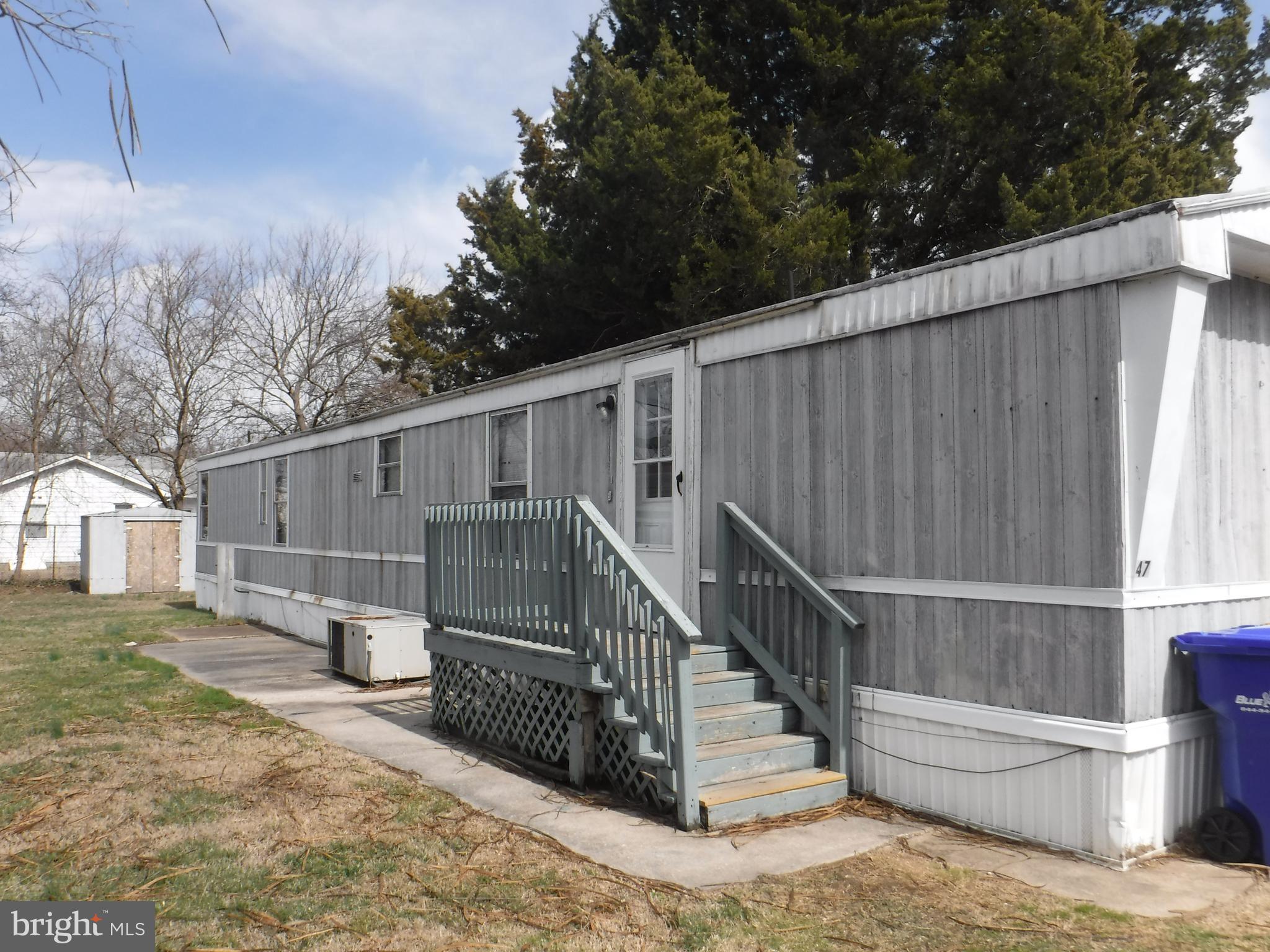 47 Shamrock Avenue Dover, DE 19901 - Photo 2 of 13 a view of a house with a small yard and wooden fence