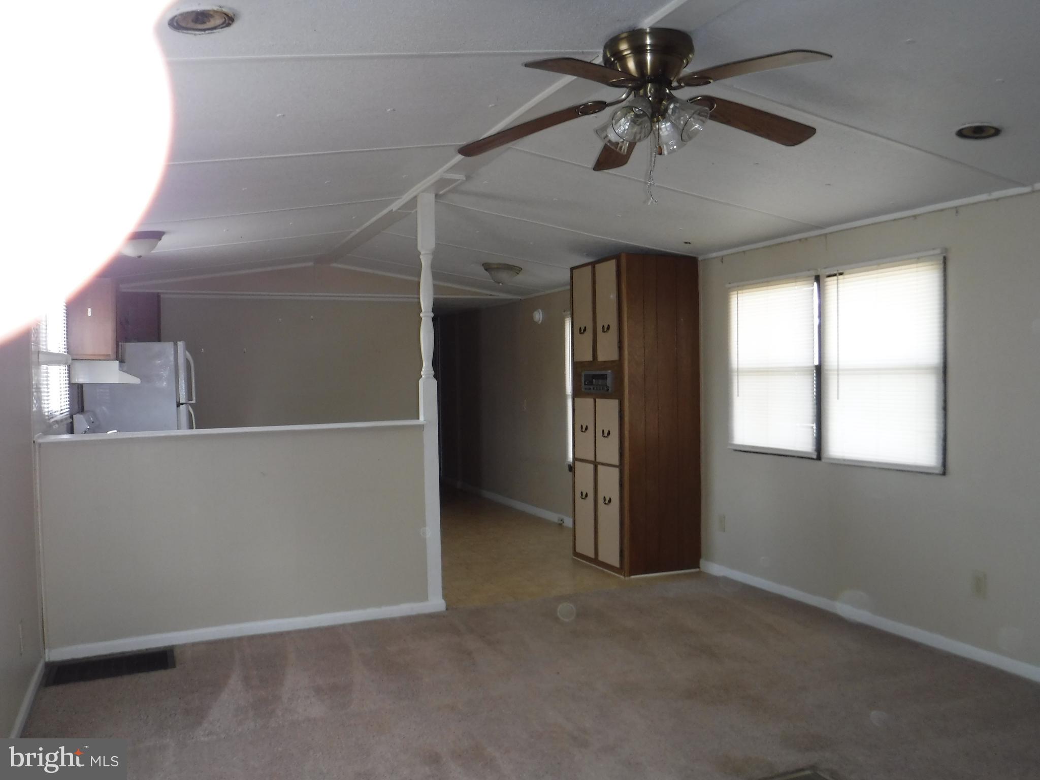 47 Shamrock Avenue Dover, DE 19901 - Photo 3 of 13 an empty room with windows and fan