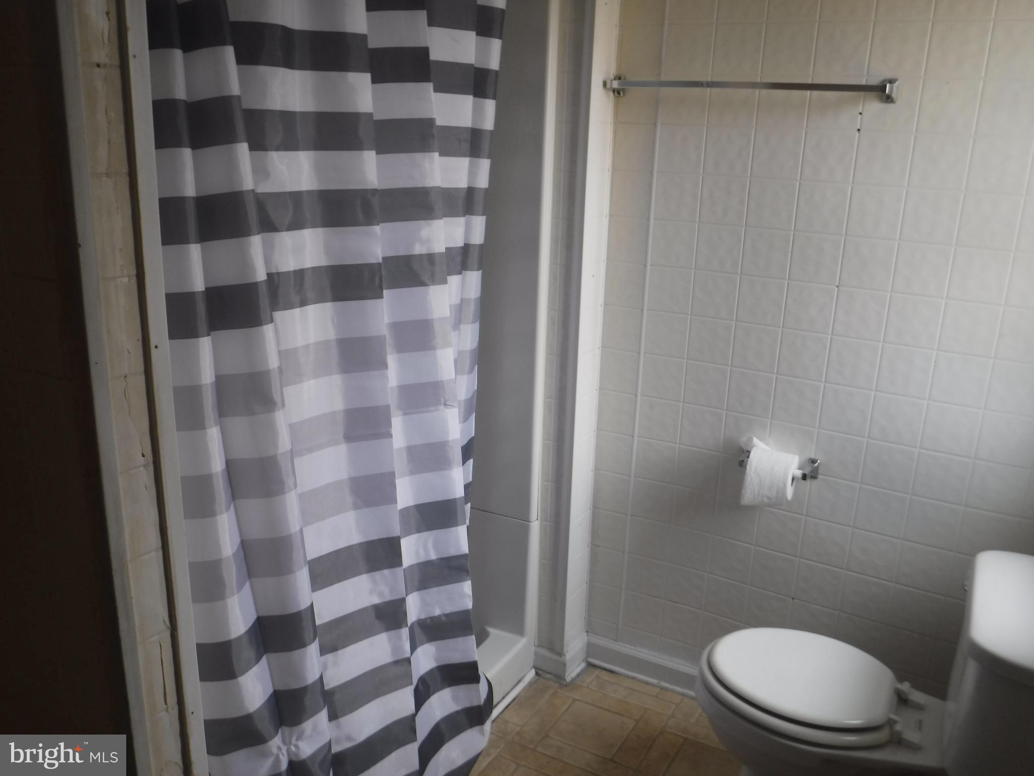47 Shamrock Avenue Dover, DE 19901 - Photo 9 of 13 a bathroom with a toilet and a shower