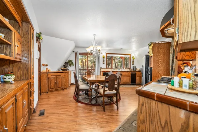 a living room with fireplace furniture and a chandelier