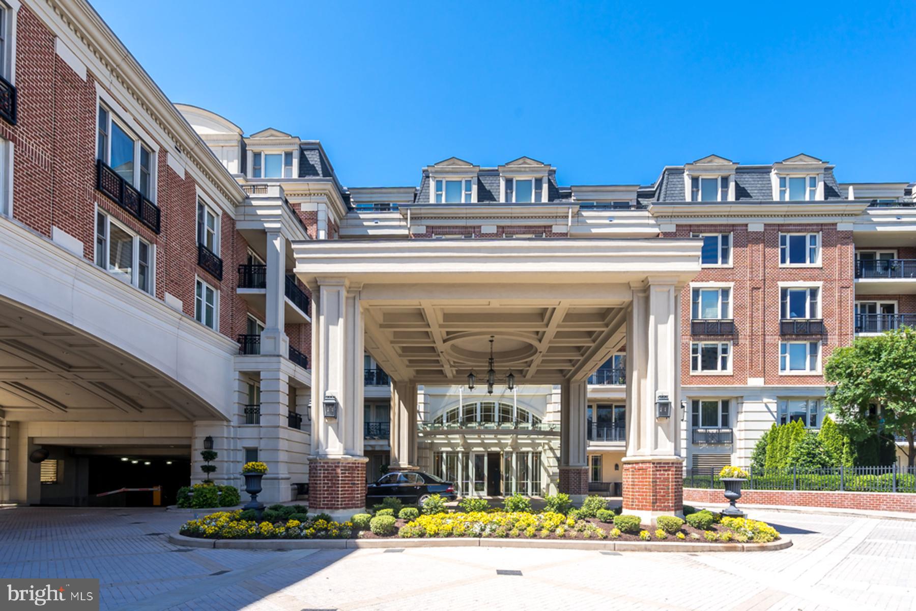 801 Key Highway, Unit 316 Baltimore, MD 21230 - Photo 1 of 1 a front view of a building with a garden and plants