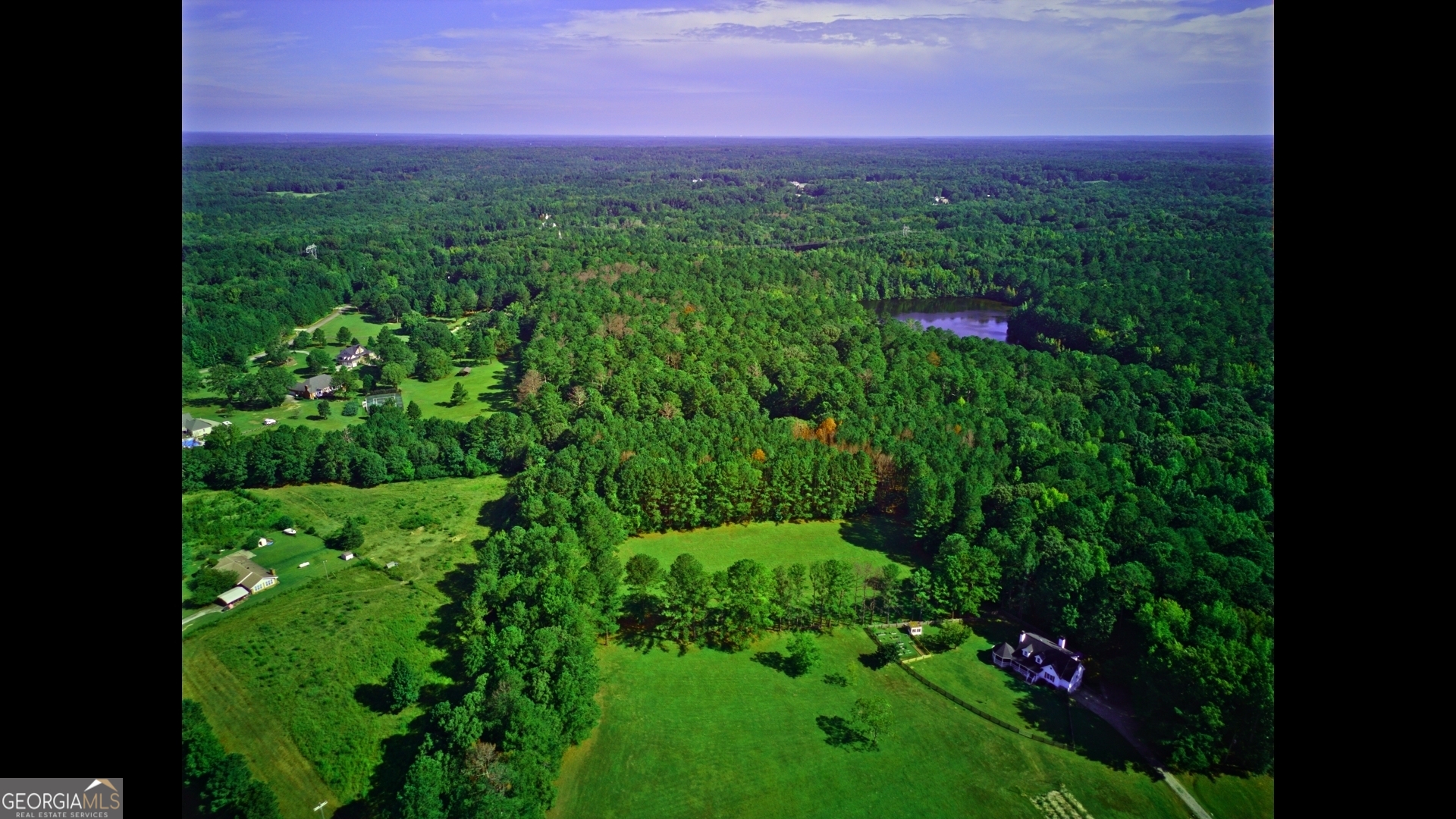 0 Huckaby Road Brooks, GA 30205 - Photo 12 of 15 a view of a lush green field in a yard
