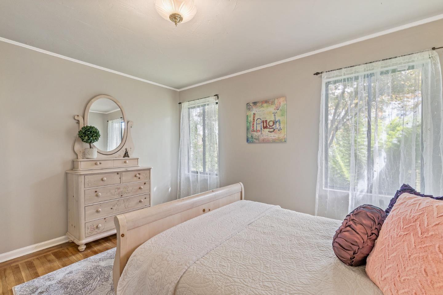 120 La Prenda Millbrae, CA 94030 - Photo 27 of 43 a bedroom with a bed and a dresser