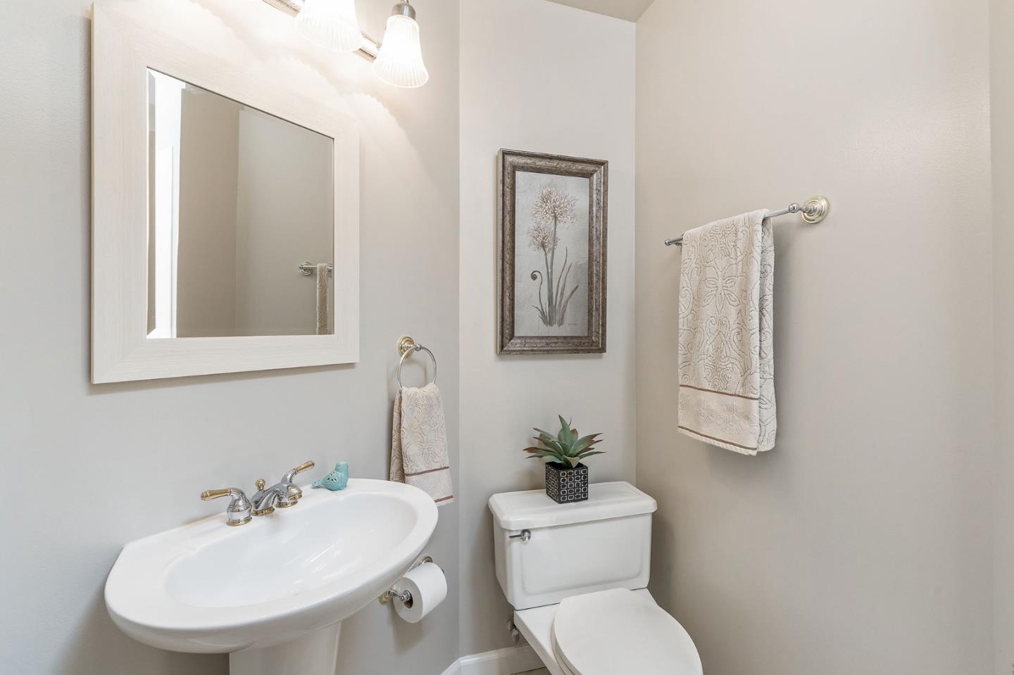 120 La Prenda Millbrae, CA 94030 - Photo 29 of 43 a bathroom with a toilet sink and mirror