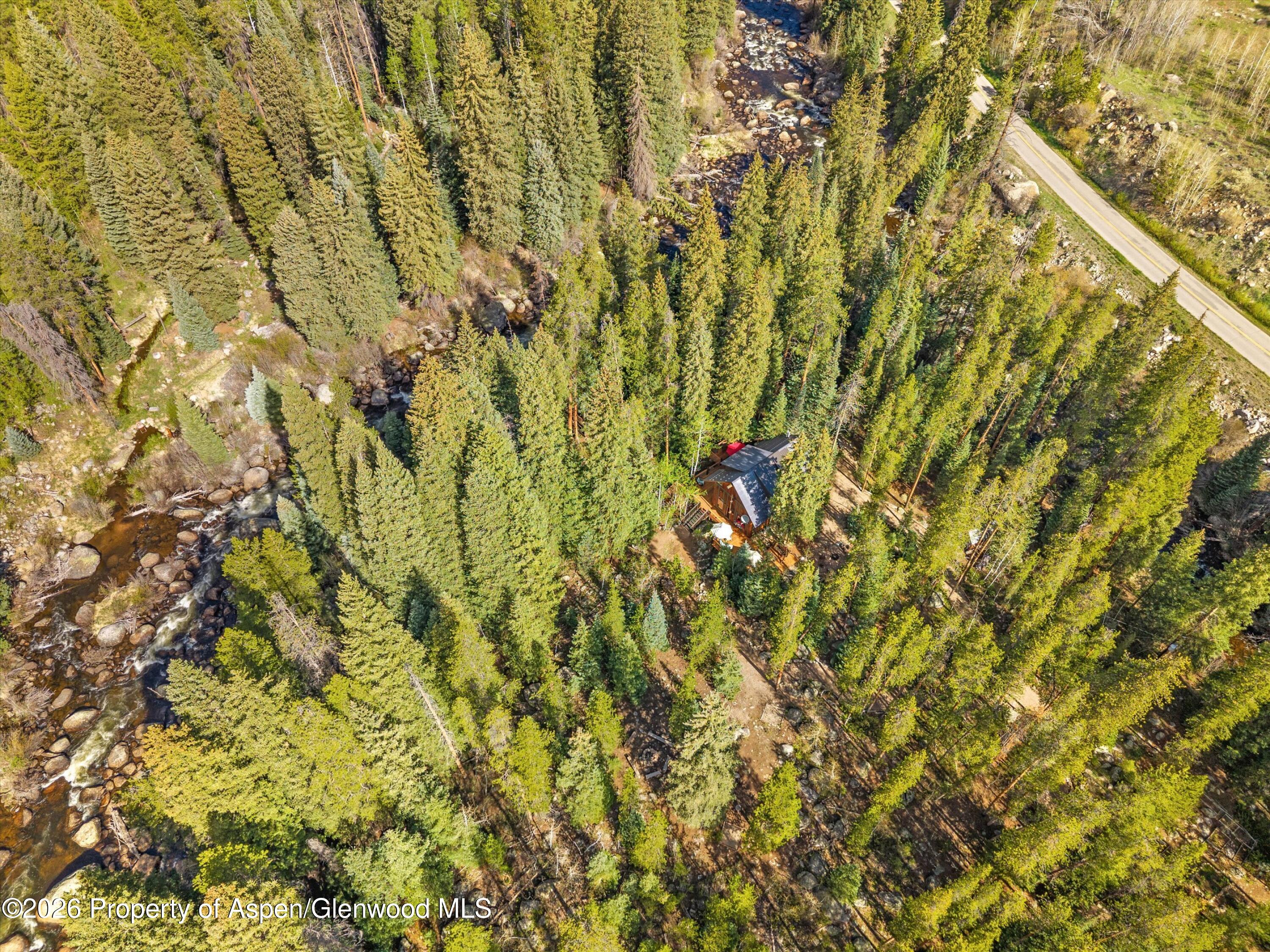 26608 Frying Pan Road Meredith, CO 81642 - Photo 36 of 49 a view of a yard with a tree