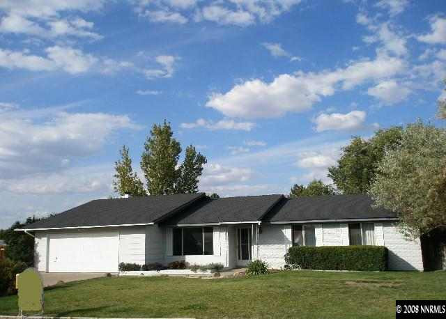 1325 Tapadero Trail Reno, NV 89521 - Photo 1 of 9 a front view of a house with a garden