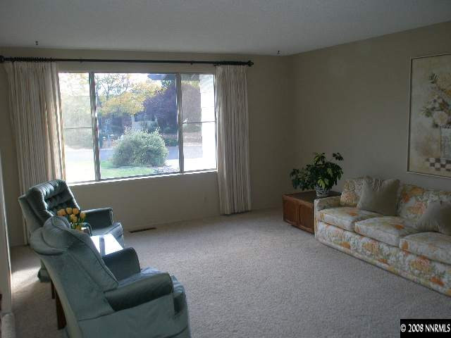 1325 Tapadero Trail Reno, NV 89521 - Photo 4 of 9 a living room with furniture and a large window