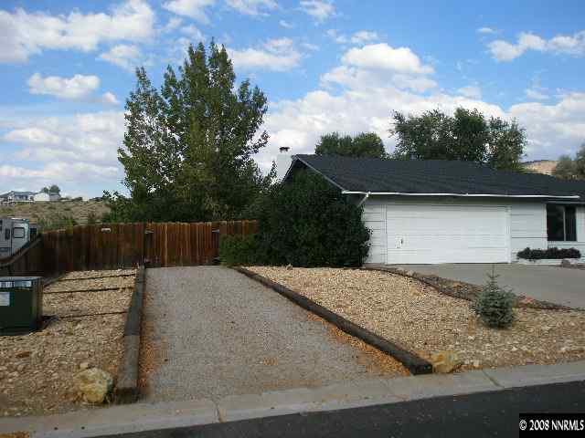 1325 Tapadero Trail Reno, NV 89521 - Photo 9 of 9 a backyard of a house with dishwasher and wooden fence
