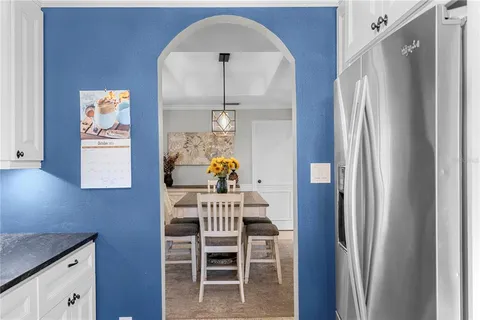 a dining room with furniture and window