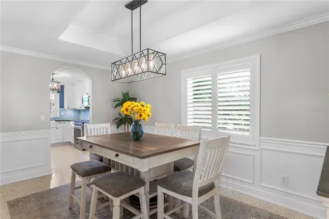 a view of a dining room and chandelier