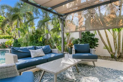 a outdoor living space with furniture and a potted plant