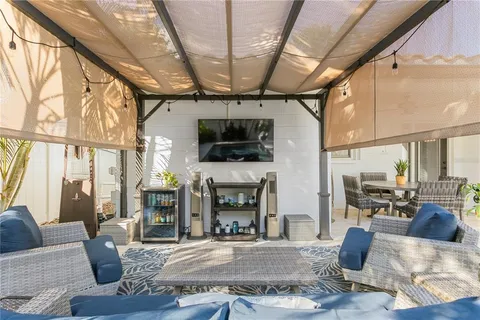 a living room with furniture fireplace and flat screen tv
