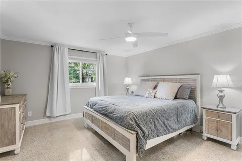 a bedroom with bed and window