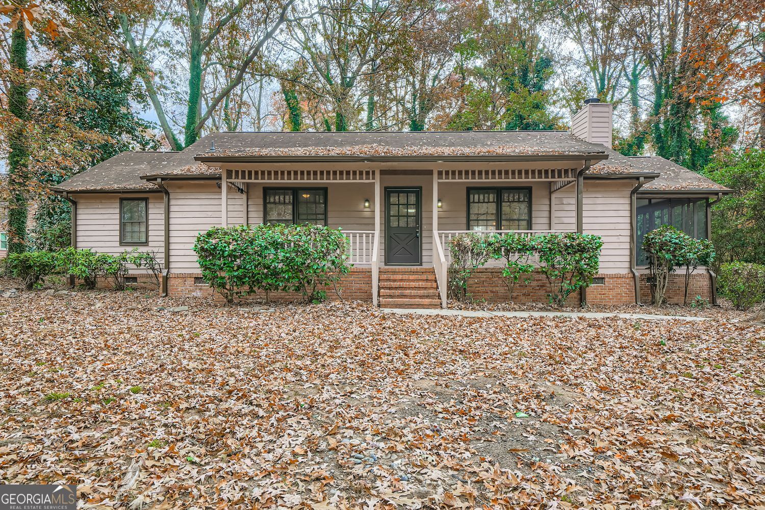 2932 Marsh Lane Southwest Stone Mountain, GA 30087 - Photo 1 of 11 front view of house with a yard