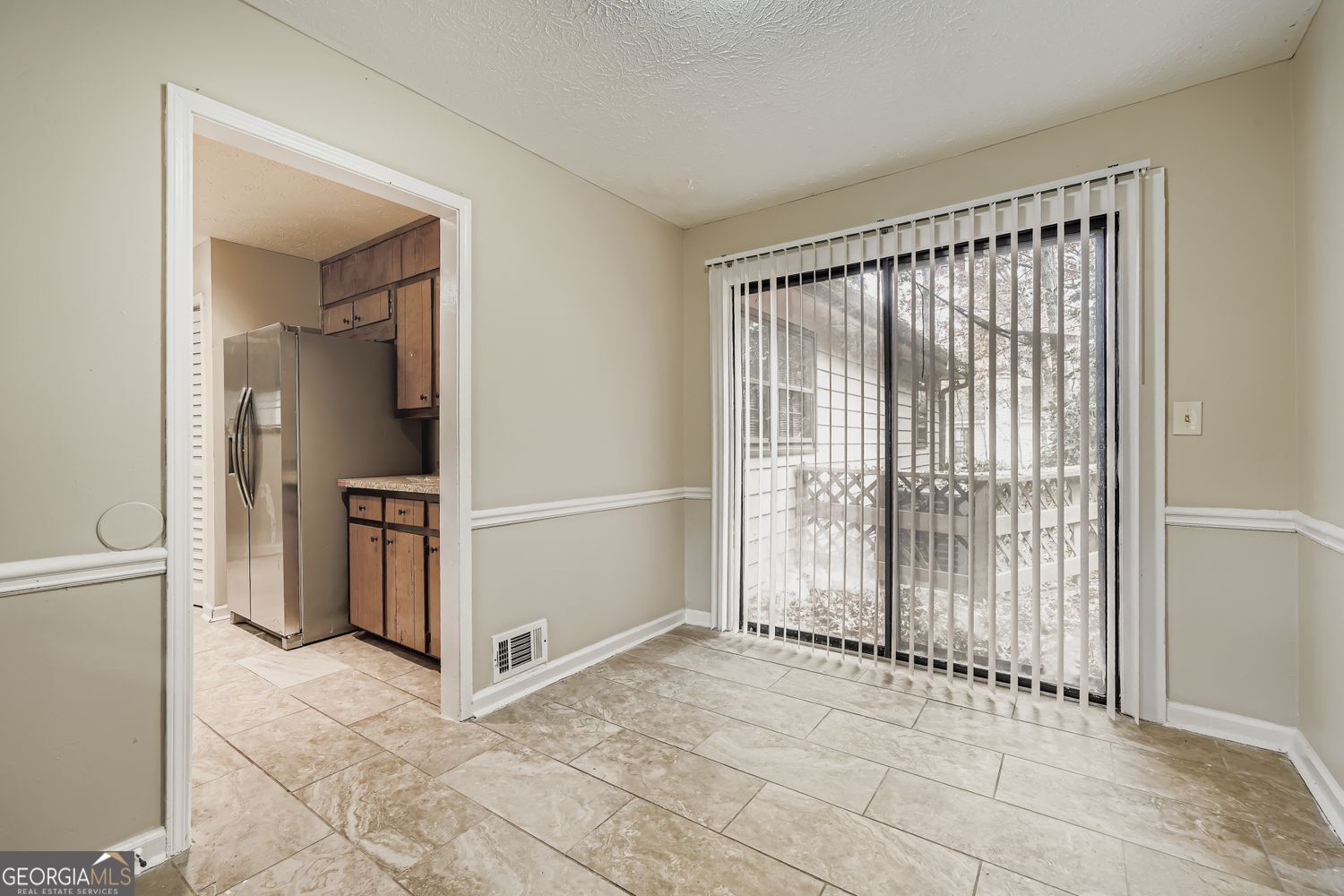 2932 Marsh Lane Southwest Stone Mountain, GA 30087 - Photo 11 of 11 a view of an empty room with a fireplace and a window
