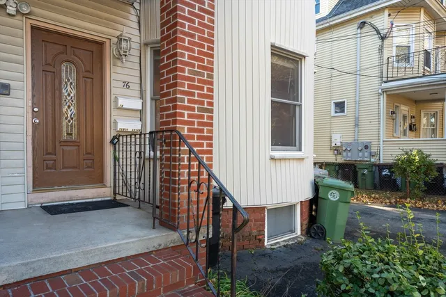 a view of a house with a small deck