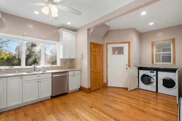 a kitchen with a stove a sink and a refrigerator