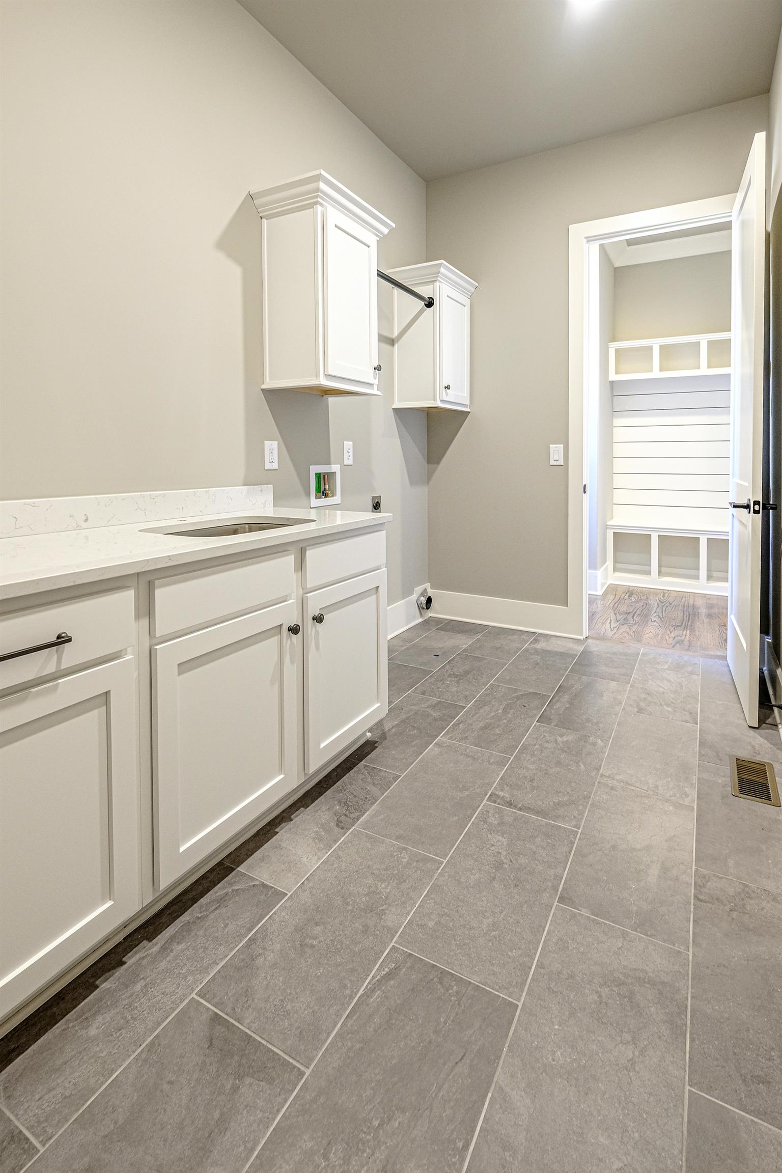 2039 Autumn Ridge Way Spring Hill, TN 37174 - Photo 13 of 30 Large laundry with extra cabinet space and soaking sink.