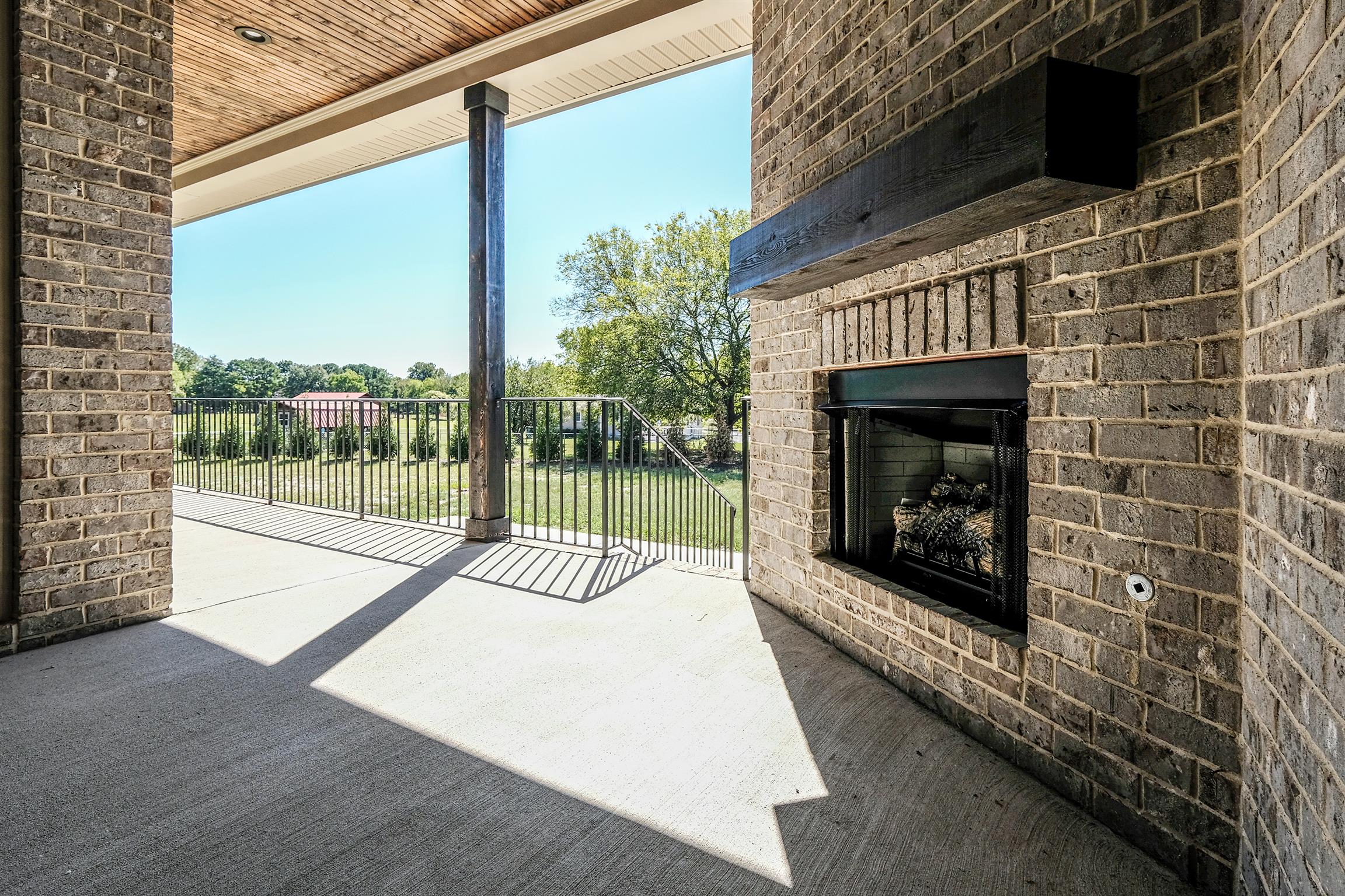 2039 Autumn Ridge Way Spring Hill, TN 37174 - Photo 27 of 30 Cozy back covered porch with fireplace and patio.