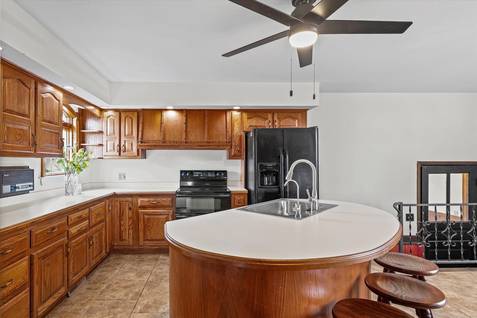 7961 North 3000 E Road Forrest, IL 61741 - Photo 20 of 66 a kitchen with stainless steel appliances a sink a stove a refrigerator cabinets and dining table
