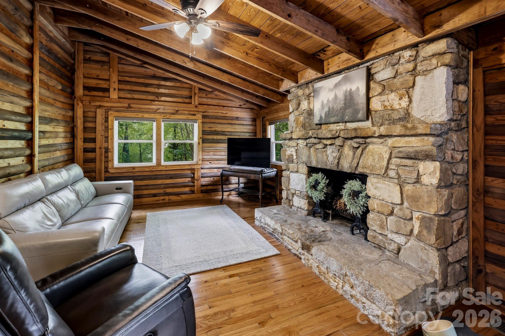 118 Rock Pt Road Lake Lure, NC 28746 - Photo 11 of 31 a living room with furniture and a fireplace