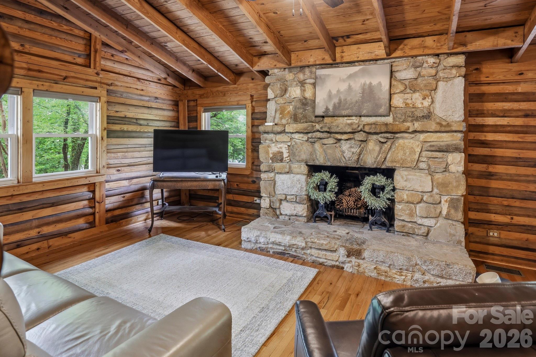 118 Rock Pt Road Lake Lure, NC 28746 - Photo 12 of 31 a living room with furniture and a flat screen tv