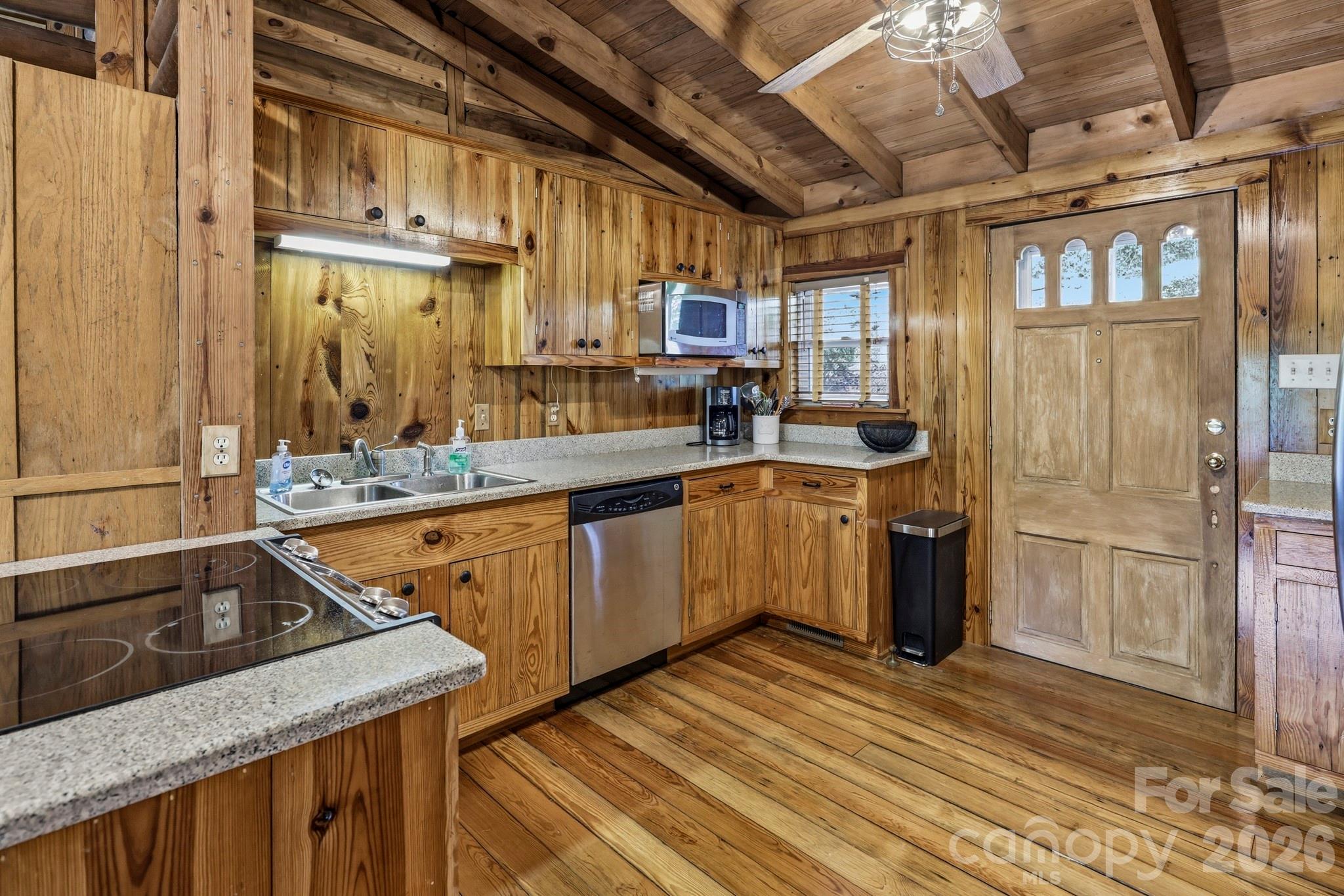 118 Rock Pt Road Lake Lure, NC 28746 - Photo 14 of 31 a kitchen with stainless steel appliances granite countertop a sink a stove and a refrigerator