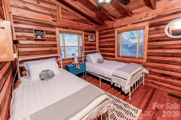 a bedroom with furniture and a window