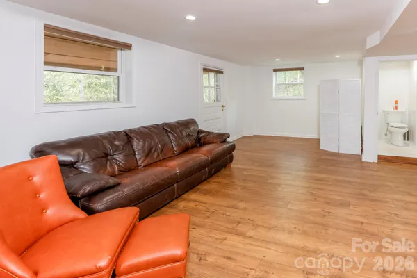 a living room with furniture and a window