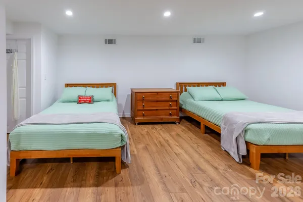 a bedroom with a bed and dresser